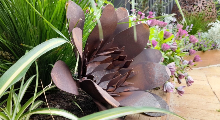 rusted metal garden art